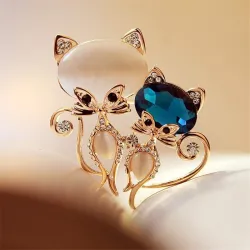 Brooch with two crystal foxes