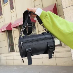 Moderigtig lille crossbody-taske - cylinderformet - unisex