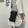 Moderigtig lille crossbody-taske - cylinderformet - unisex