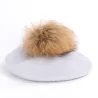 Elegant beret with fur pom-pomHats & Caps